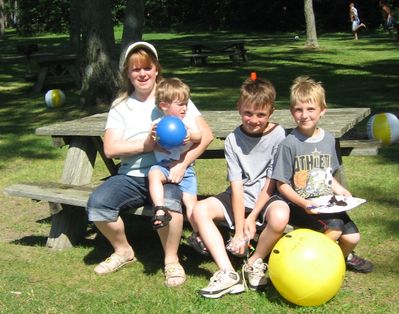 The People
The Entwistles: Joan Higham Entwistle holding Cole, Tyler, and Justin
