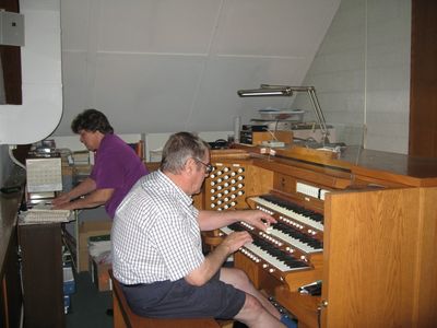 Dave Smith Visit at the Organ 3
Dave gives the Allen Organ a spin at OLS.  Church organist, Marcia, in background.
