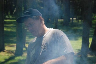 Reunion 2010 Chefs at Work
Ted at the grill.  Lots of smoke.
