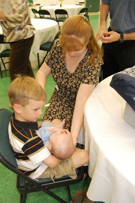 Sunday Party at OLS School
Guests: Sam Hughes holds Eli Glazer, mother Mary Higham Glazer looks on.
