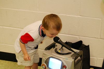 Sunday Party at OLS School
Now Hear This!  Cole Entwistle tests the sound system.
