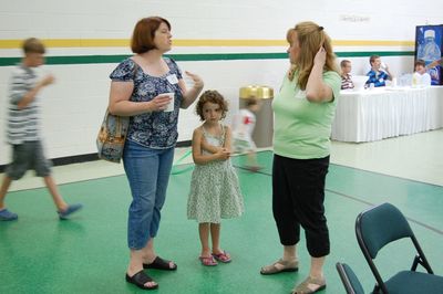 Sunday Party at OLS School
Guests: Lynelle Howey talks with Joan Higham Entwistle.  Silvi Howey looks on.
