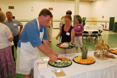 Sunday Party at OLS School
Food Prep.  Ted Foley and Ann Higham Hughes replenish the appetizers.
