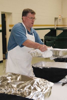 Sunday Party at OLS School
Food prep:  Hot! Hot! Hot! says Ted Foley as the buffet is set.

