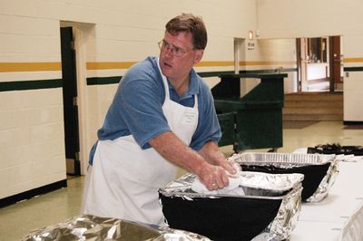 Sunday Party at OLS School
Food prep: Ted Foley readies the buffet.
