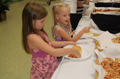 Sunday Party at OLS School
Food: Buffet:  Julia and Madison Higham help themselves.
