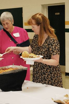 Sunday Party at OLS School
Food. Buffet: Mary Glazer helps Jill Glazer at the buffet.
