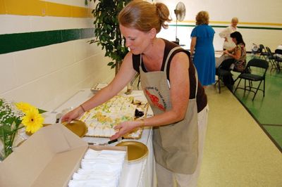 Sunday Party at OLS School
Cake:  Ann Hughes assists with serving the cake.
