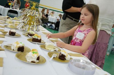 Sunday Party at OLS School
Cake:  Julia Higham chooses her slice of cake.
