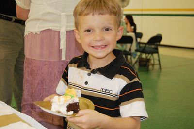 Sunday Party at OLS School
Cake: Sam Hughes is happy with his cake.
