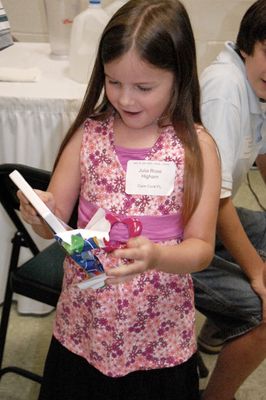 Sunday Party at OLS School
Games: Julia Higham opens her gift.
