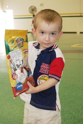 Sunday Party at OLS School
Games Gifts: Cole Entwistle shows his gift.
