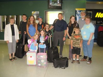 Arrivals for 50th Anniversary 1
The Highams arrive from Florida at Elmira Airport.  
L to R: Jan; Jacob; Cathy; Nicholas; Thomas; John; Rachel; Uncle Bob and Aunt Betty;
(in front) Madison; Julia; and Jeffrey Yuelling
