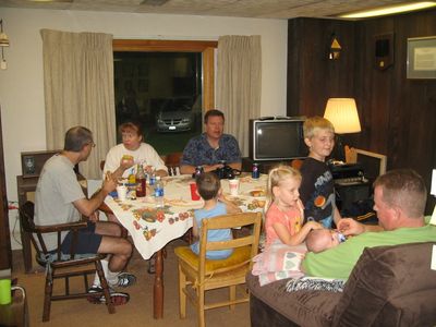 Friday/Saturday Breakfast and Picnic
Picnic: At table: Mark; Mary; Joe; Cole (back to camera) 
Madison and Justin watch John with Eli in the Rec Room
