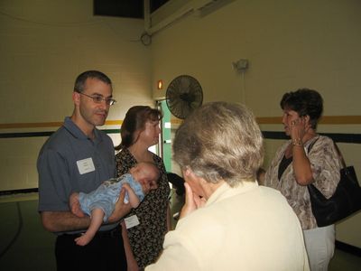 Sunday Party at OLS School
Guests: Mark, Eli and Mary Higham Glazer greet Echo Road neighbors Louisa Matula (back to camera) and Jo Jennings
