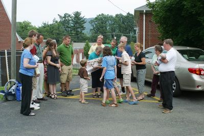 Saturday Church 1
Church 1: Gift opening: Mary Higham Glazer; Arik Foley; Ben Hughes; Peg and Katie Higham; Andy Foley; Sam Hughes; Jan, Jim, Laurel, David, and Jack Higham; Riley and Ann Hughes; Sue and Ted Foley (holding Eli Glazer)
