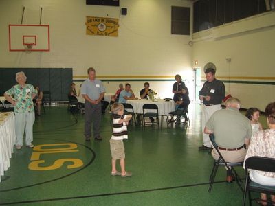 Sunday Party at OLS School
Tables: Joe Higham asks the blessing before the buffet.
