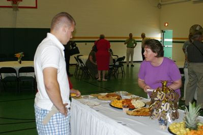 Sunday Party at OLS School
Food Prep: Andy Foley and Mom, Sue Higham Foley, look over the appetizer arrangement.
