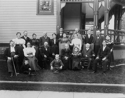 Higham Family
Joseph and Susanna Cheetham Higham Family Photo, circa 1900
with house at 418 Floyd Avenue, Rome, NY, in the background.
 
Front Row (left to right): Ellsworth Elmer Mack; Joel Williams Higham (son of Thomas): 

Second Row: Elmer Ellsworth Mack; Sarah Jane Higham; Thomas Cheetham Higham; Susanna Cheetham Higham; Jane Stevens Higham (Brown)(5); Joseph Higham; Joseph Elbert Higham(3);

Third Row: Elizabeth Higham Mack; William Higham (son of Charles); Ellen (Aunt Nell) VanKleek  Higham (wife of Charles); Charles Cheetham Higham; Elizabeth Elliot Higham (wife of Thomas); Elvira Stevens Higham (wife of William); Jane Elliot Higham (Frandsen)(daughter of Thomas)(white blouse);

Back Row:   Charles William Higham(1); John Cheadle Higham; Wilfred Ray Higham(2); William Smith Higham; Elizabeth Alice Higham(4)

[N.B.:   (1) through (5) are children of William and Elvira Stevens Higham (according to age)] 
